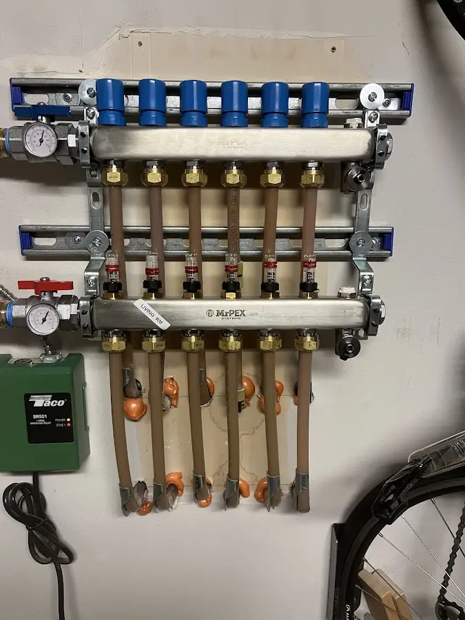 Plumber performing Gas Leak Detection at a residential property in Swansea